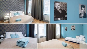 Una habitación de hotel con cama, mesita de noche, lámpara y ventana con cortinas.