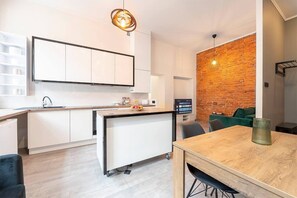 Apartment, Multiple Beds | Private kitchen | Fridge, oven, stovetop, dishwasher
