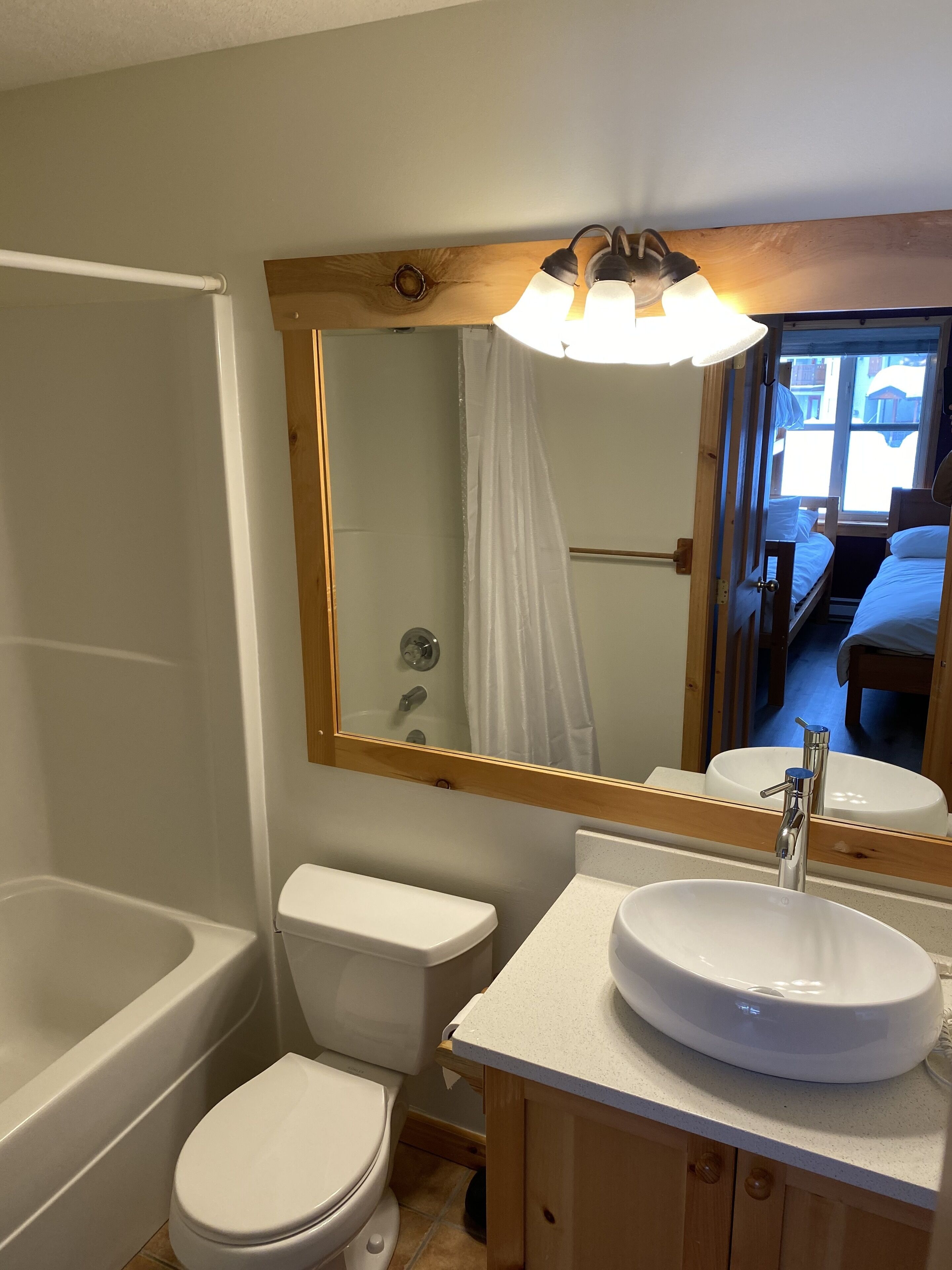 Combined shower/tub, hair dryer, towels, soap