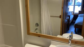 Combined shower/tub, hair dryer, towels, soap