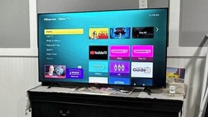 A flat-screen TV on a black dresser with a TV channel interface visible. - Guesthouse studio Generac backup powered w washer&dryer. Fully equipped. (Spring)