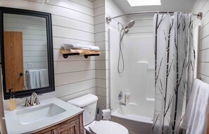 Combined shower/tub, hair dryer, towels, soap