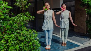 Two individuals standing in front of a building with a sign that reads "SECTION 1 Asakusa East". -  Section L Residence Asakusa East  (Tokyo)