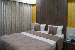 Deluxe Room | Soundproofing, free WiFi, bed sheets - Hotel Midtown (Vadodara)