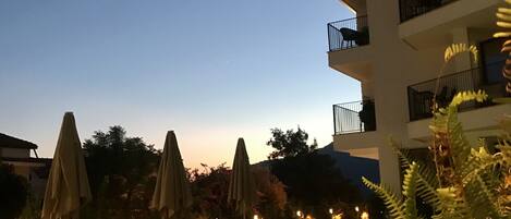 Seasonal outdoor pool, pool umbrellas, pool loungers