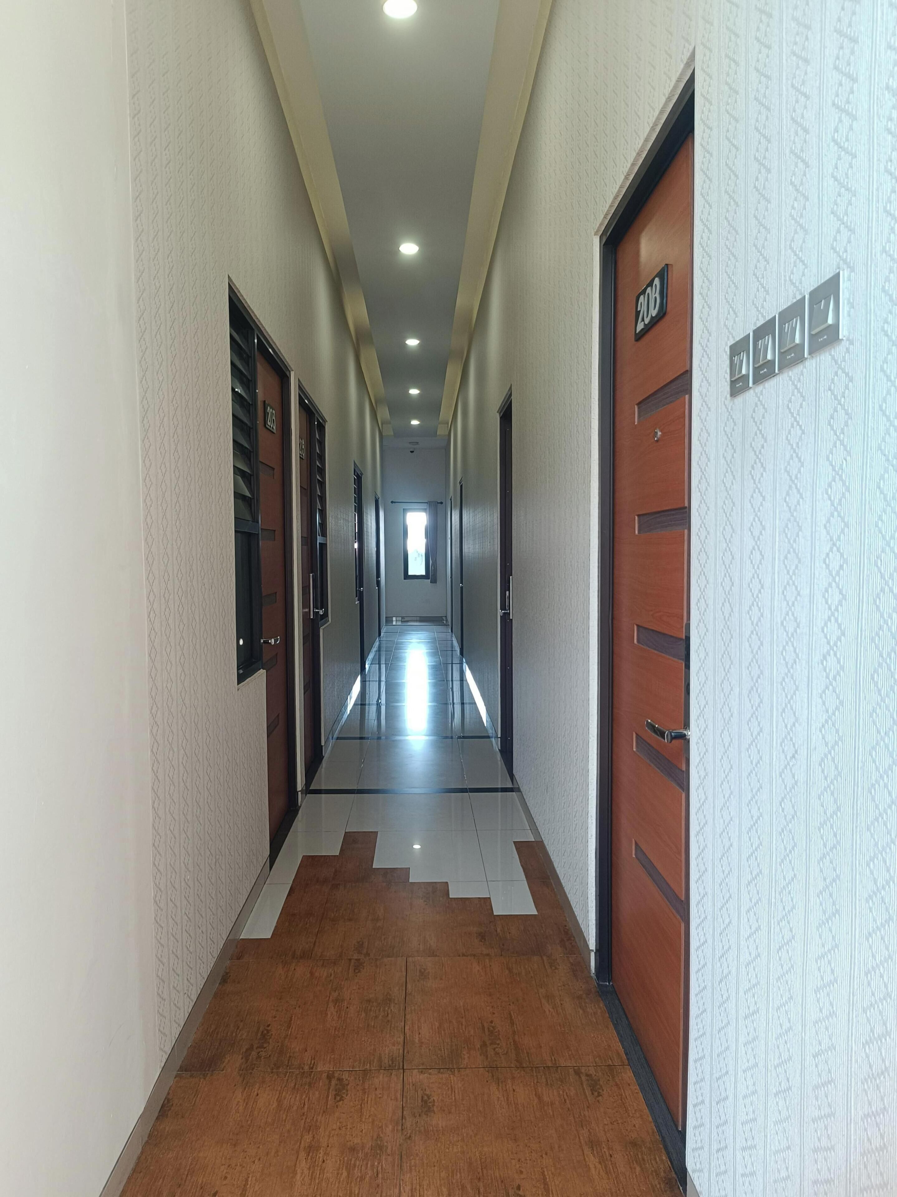 A hallway with doors numbered 200 and 201, leading to rooms.