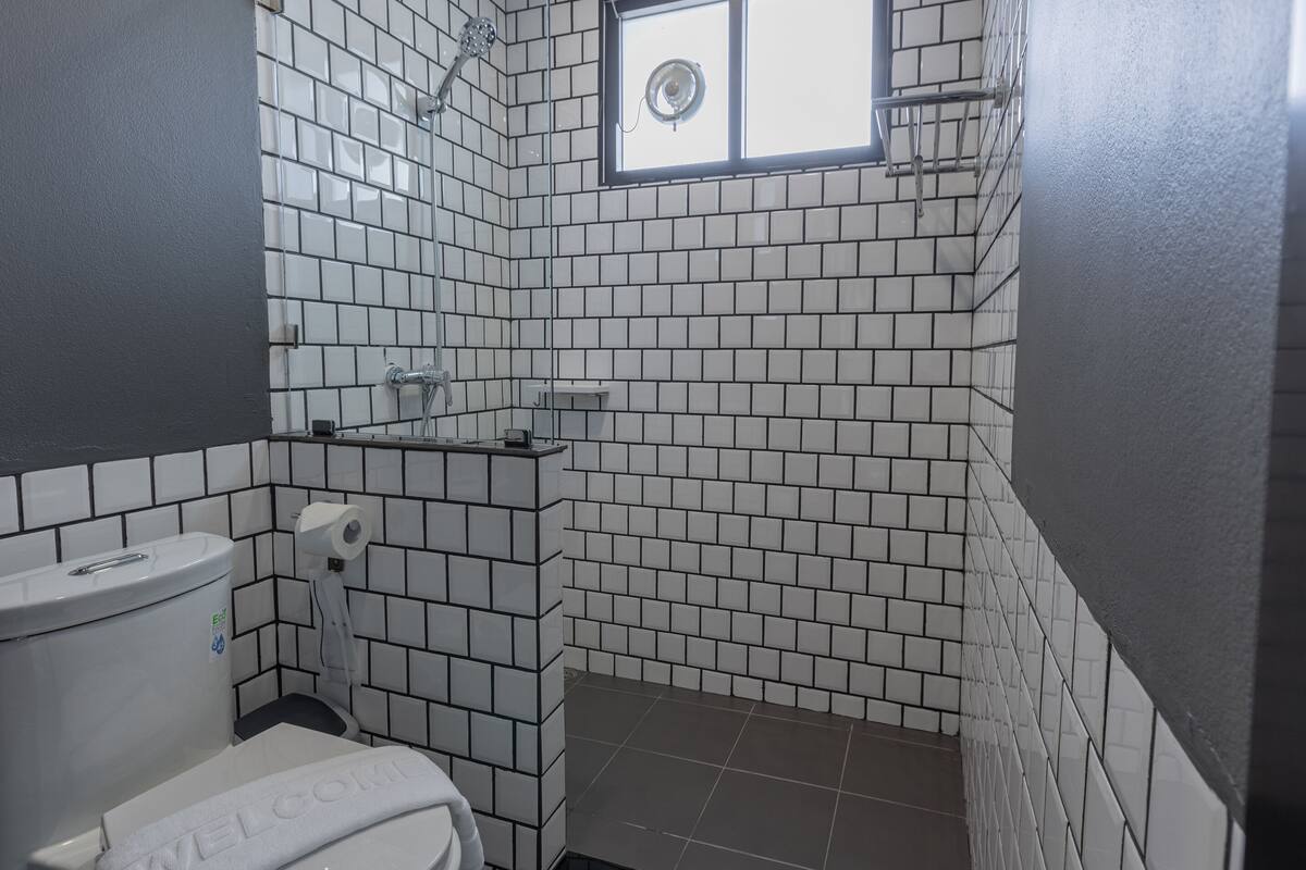 shower, rainfall showerhead, hair dryer, towels