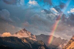 A mountain landscape with a rainbow.