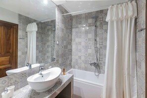 Bathtub, hair dryer, towels