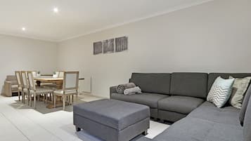 Basic Townhome | Living area | Flat-screen TV