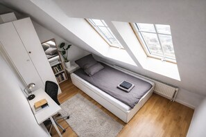 A compact, modern bedroom with a loft bed, a desk, and a bookshelf. - Mauerpark Mitte-Prenzl.Berg Penthouse, modern and authentic. 3 BR, 2 Bath (Berlin)