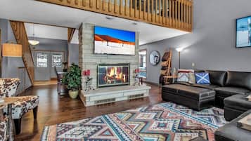 TV connectée, cheminée, jeux vidéo, livres