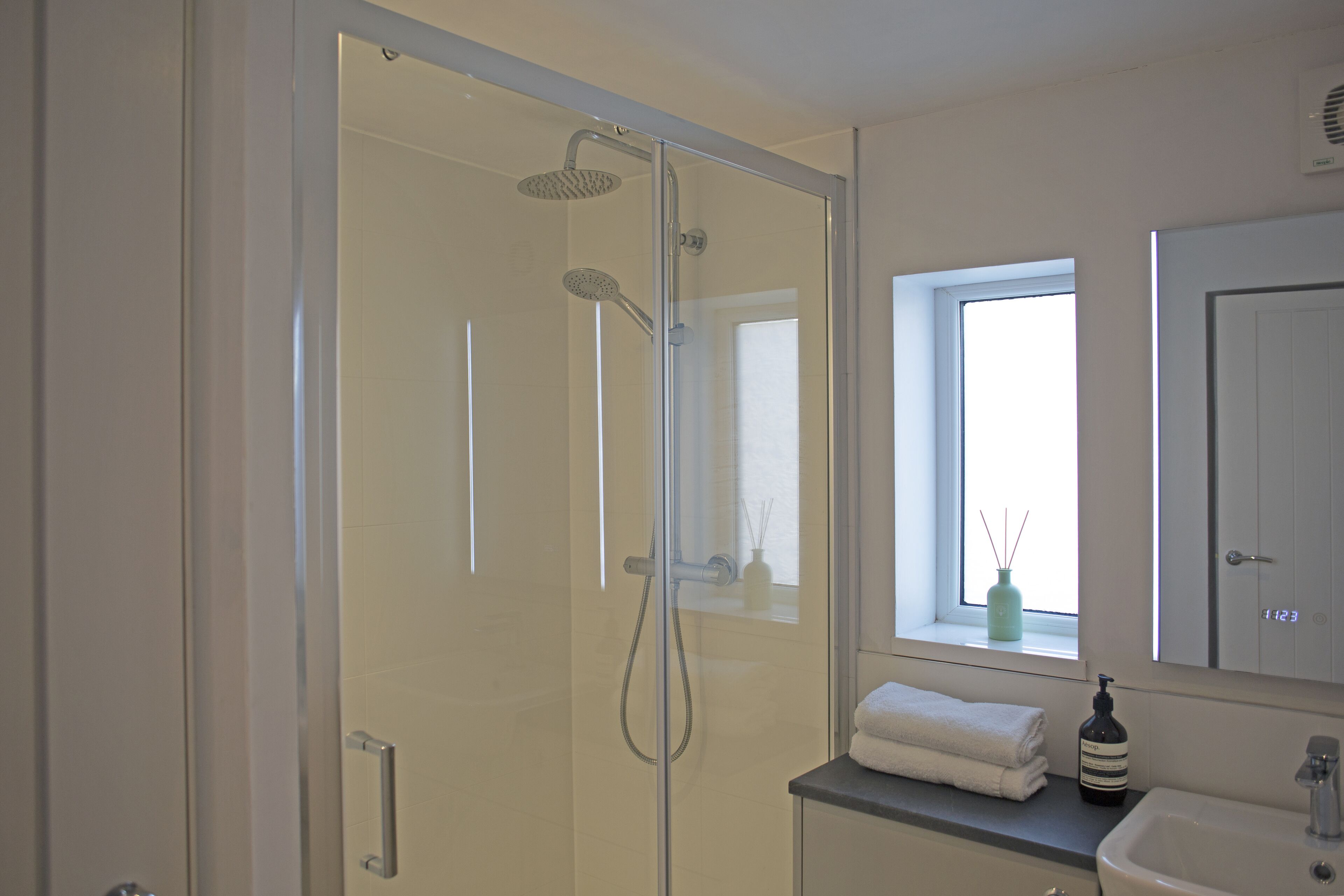 Shower, hair dryer, towels, soap