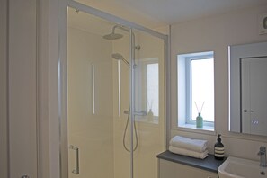 Shower, hair dryer, towels, soap