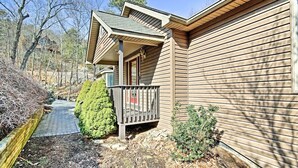 A single-story house with a front porch, a small deck, and a pathway leading to the entrance. - Maple Highlands: Under 1 Mile to Lift! Mountaintop Estate with 2 Scenic Decks (McGaheysville)
