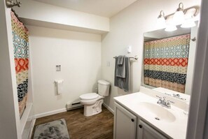 Bathtub, hair dryer, towels, soap