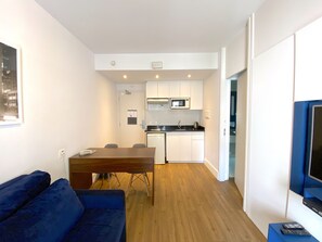 Standard Room, 1 Bedroom | Living area | 42-inch flat-screen TV with cable channels, TV
