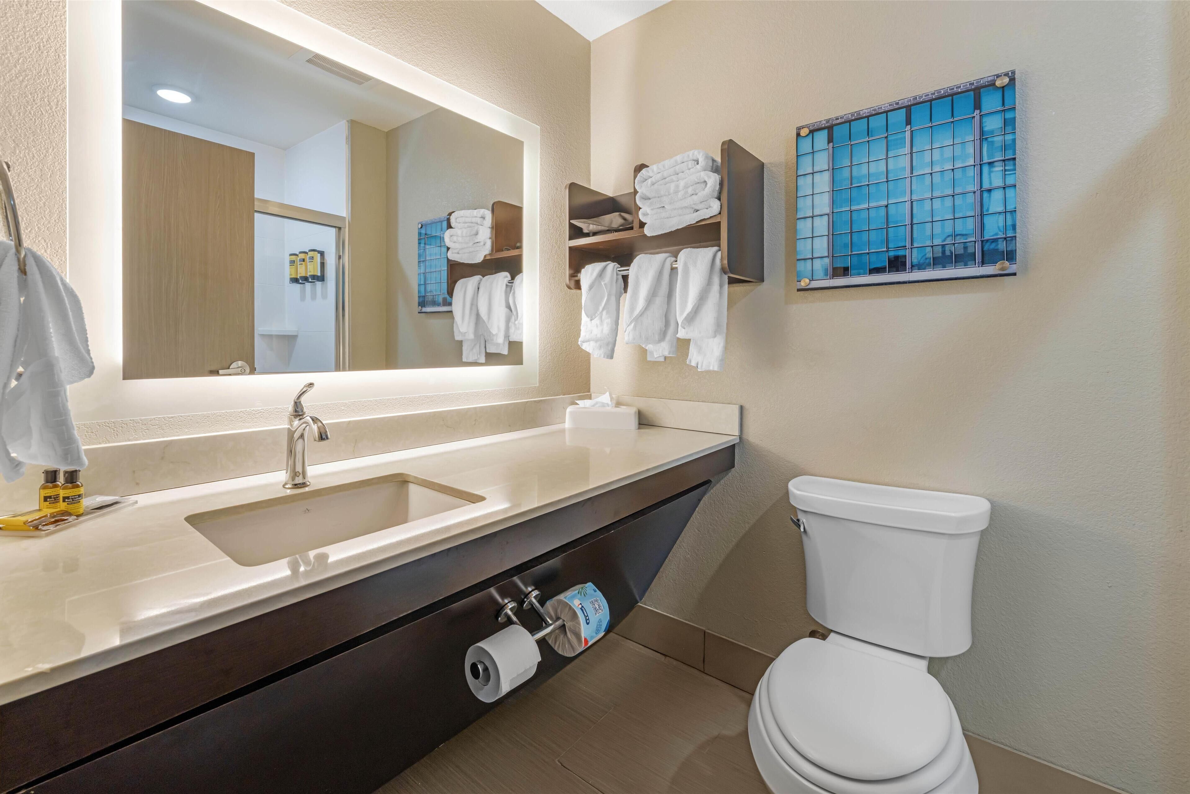 standard room, 2 queen beds, non smoking, refrigerator & microwave | bathroom | hydromassage showerhead, hair dryer, towels, soap