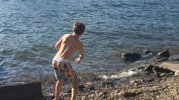On the beach, sun loungers, beach towels