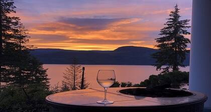 Semi-lake front on Shuswap lake with private beach dock and bouy.