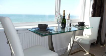 With spectacular sea views the flat is literally across the road from the Beach.
