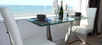With spectacular sea views the flat is literally across the road from the Beach.