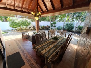 Enjoy al fresco dining in this serene garden setting, surrounded by lush greenery and a tranquil atmosphere.