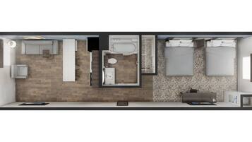 Quarto de hotel moderno com piso de madeira, uma cama grande, banheiro privativo, um espaço de estar pequeno e uma escrivaninha.