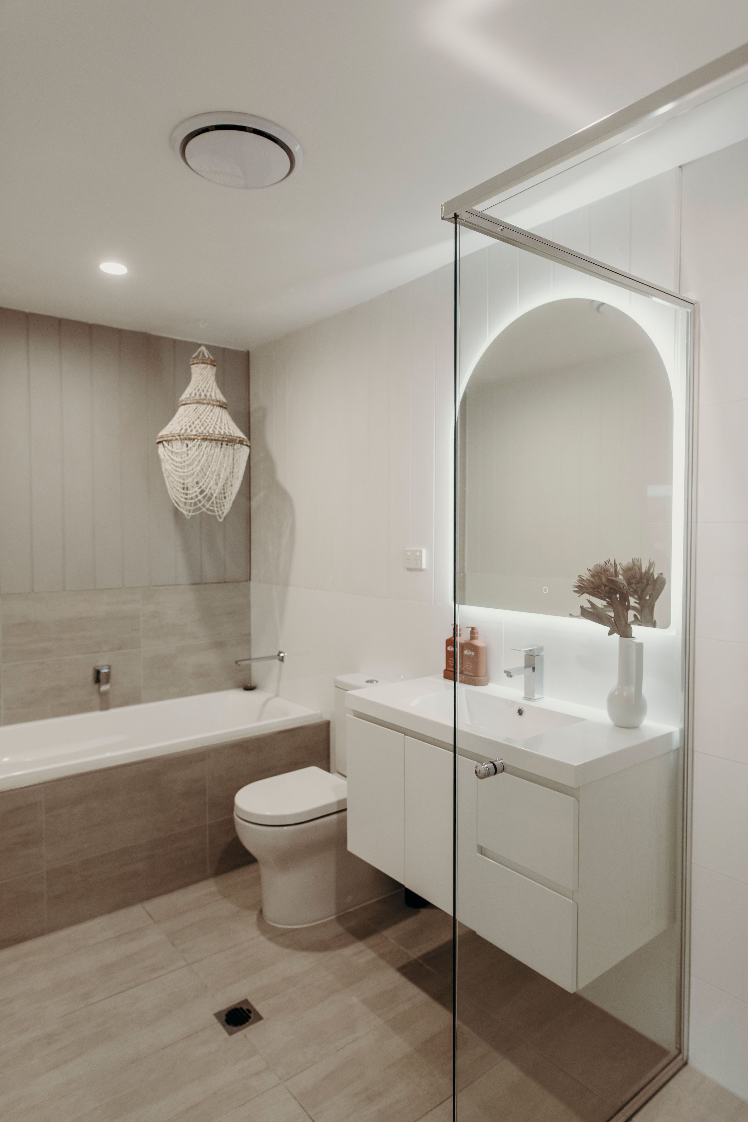 Bathtub, towels, soap, toilet paper