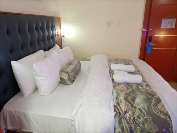 Habitación Deluxe | Ropa de cama de alta calidad y edredón