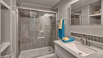 Shower, hair dryer, towels, soap