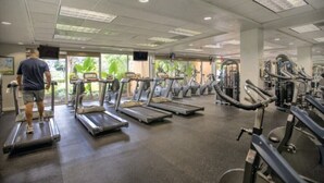 A gym with treadmills, stationary bikes, and weight machines. - Pompano Beach | Group Golf Vacation | Pool + Golf | 4BR Sleeps 12 (Pompano Beach)