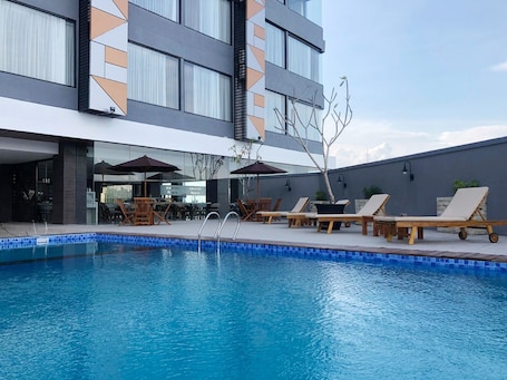 Outdoor pool, open 6:00 AM to 7:00 PM, sun loungers