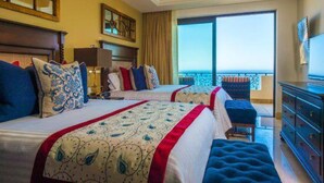 A hotel room with two beds, a large window, a balcony, and a television. - 2Bedroom 3Bath Ocean Presidential Unit (Cabo San lucas)
