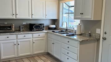 Fridge, microwave, stovetop, coffee/tea maker