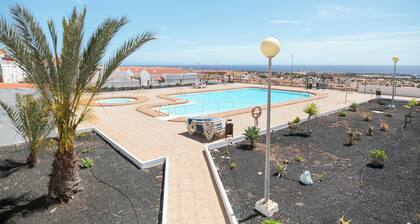 Holiday Apartment “Caleta Beach Deluxe” with Pool, Wi-Fi, Terrace