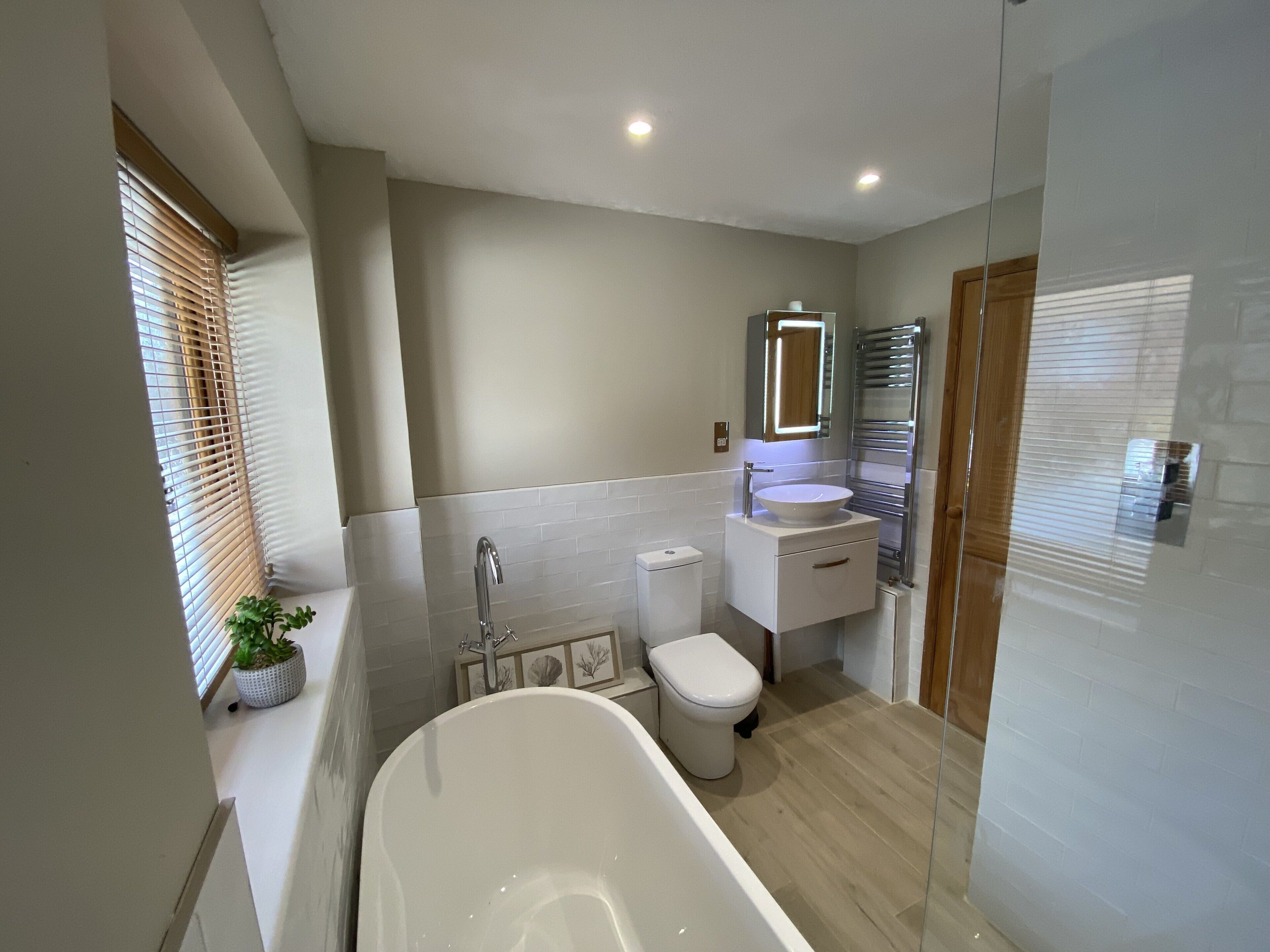 Bathtub, hair dryer, towels, soap