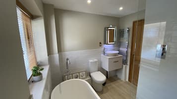 Bathtub, hair dryer, towels, soap