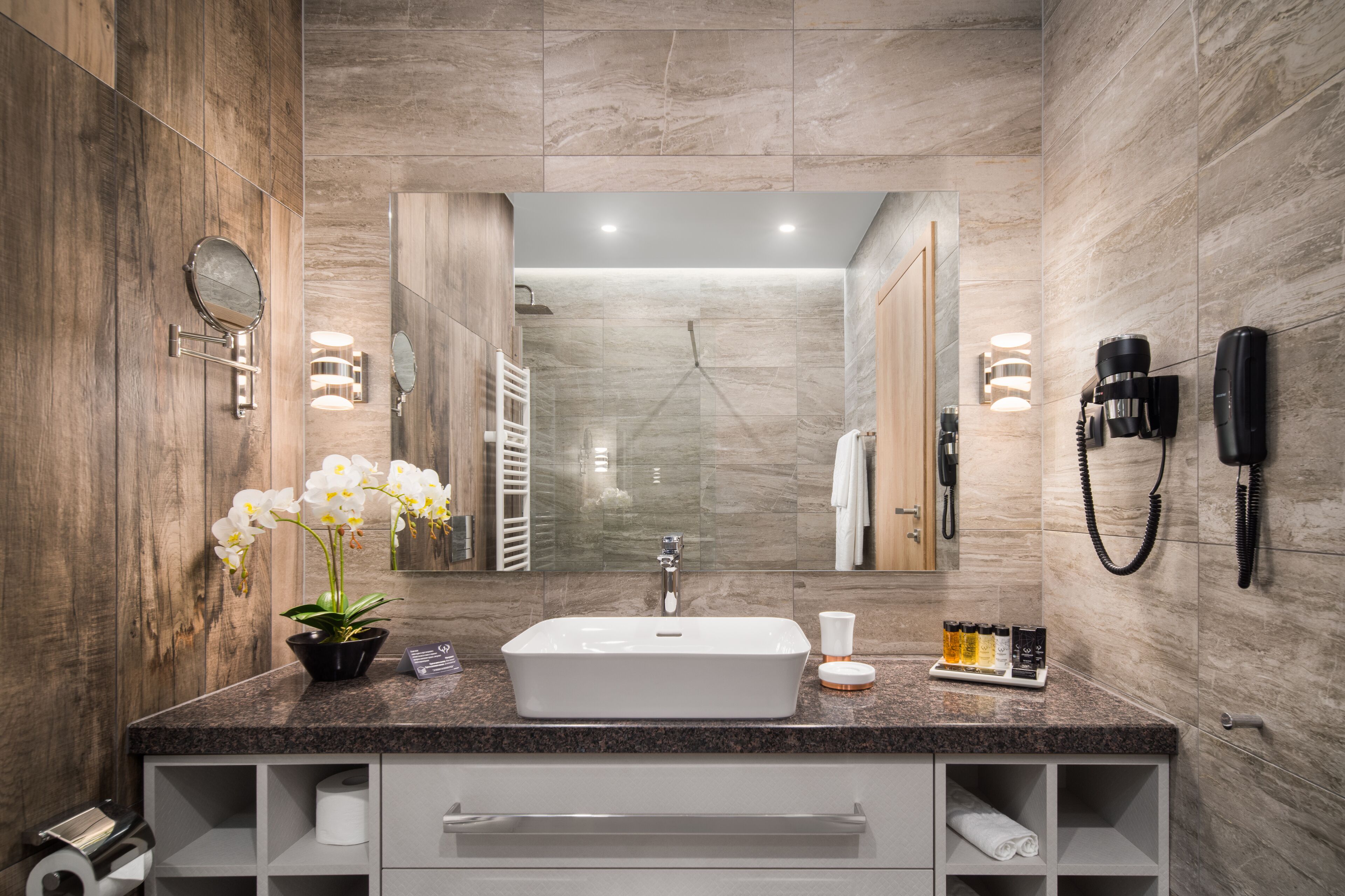 rainfall showerhead, hair dryer, slippers, towels