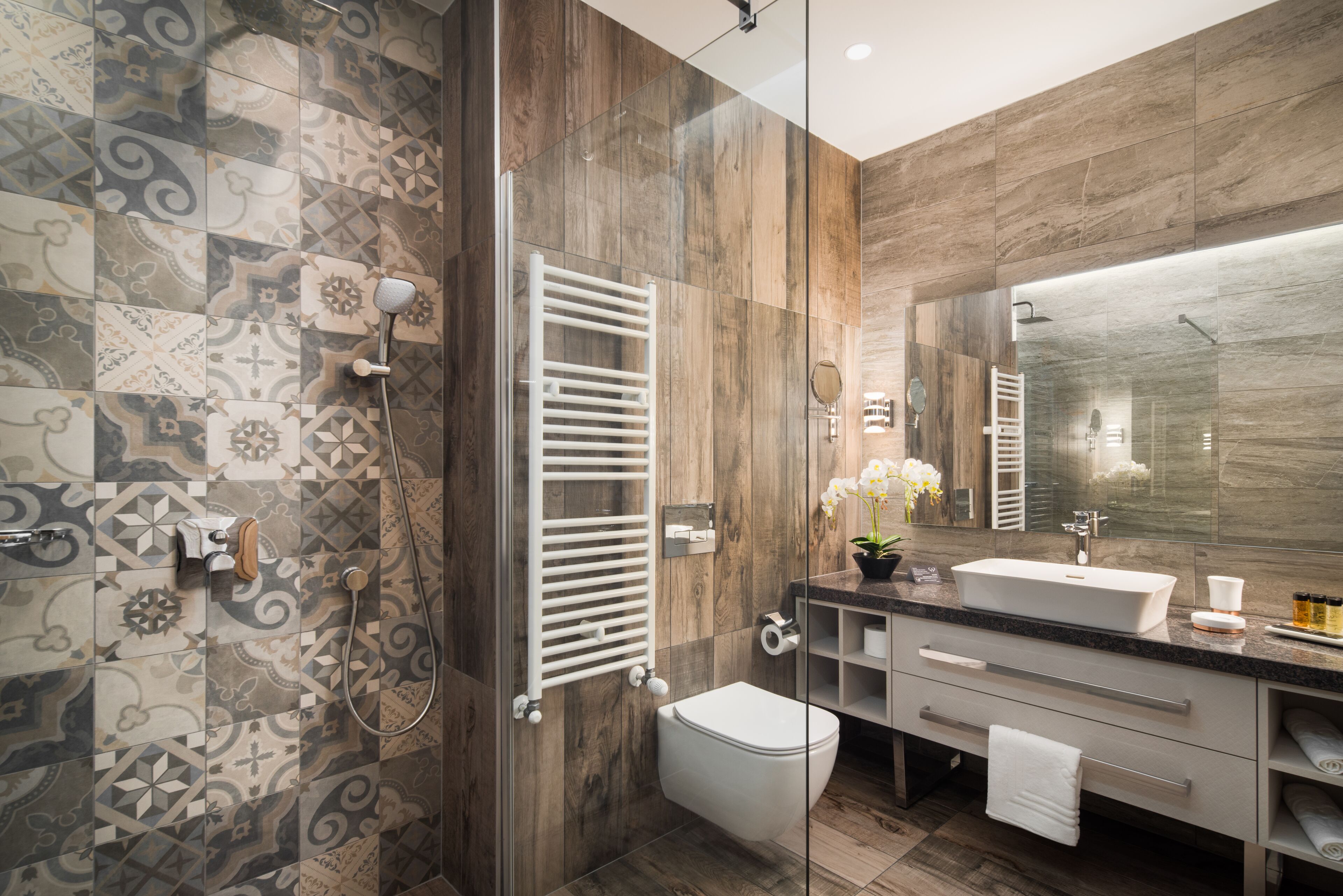 rainfall showerhead, hair dryer, slippers, towels