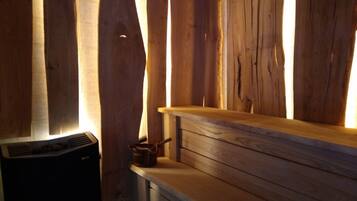 A wooden interior with a built-in bench and a radiator.