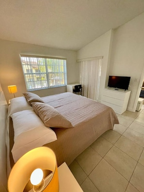 1 bedroom, desk, iron/ironing board, travel crib