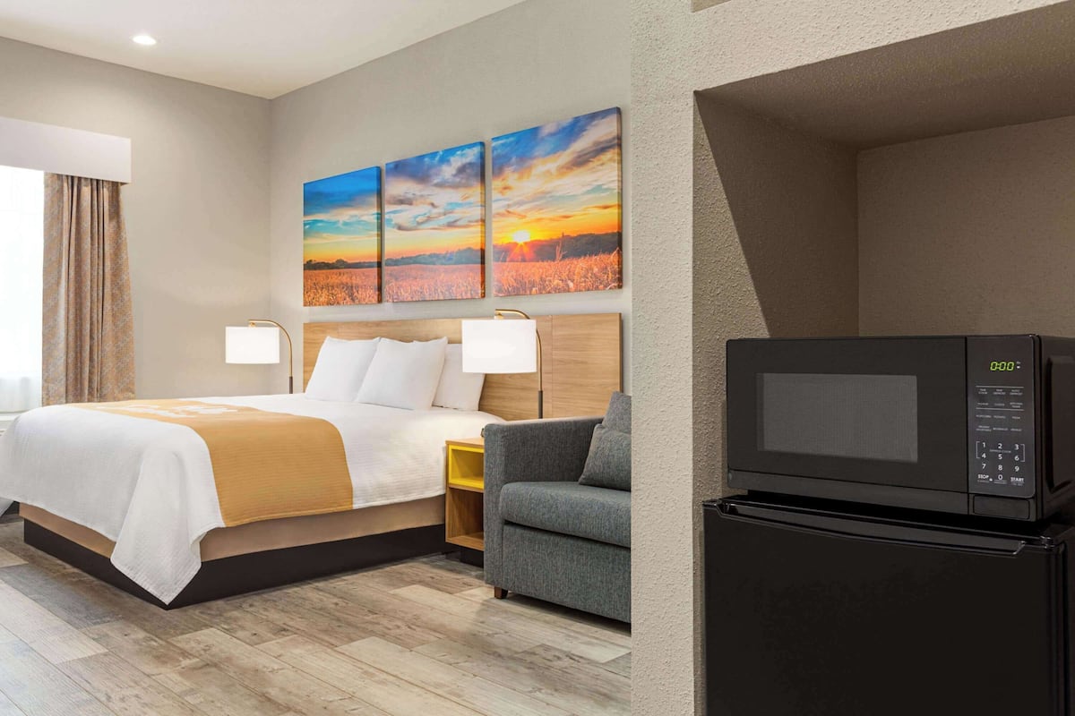 Suite Confort, 1 cama King size, para no fumadores | 1 habitación, ropa de cama de alta calidad y edredón