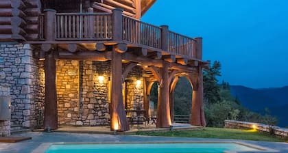 Luxury secluded mountain log chalet with pool (shared)