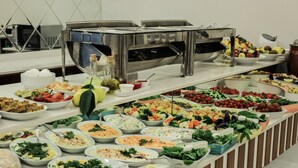 A buffet with various dishes including salads, fruits, and meats. - Business Hotel Antalya (Antalya)