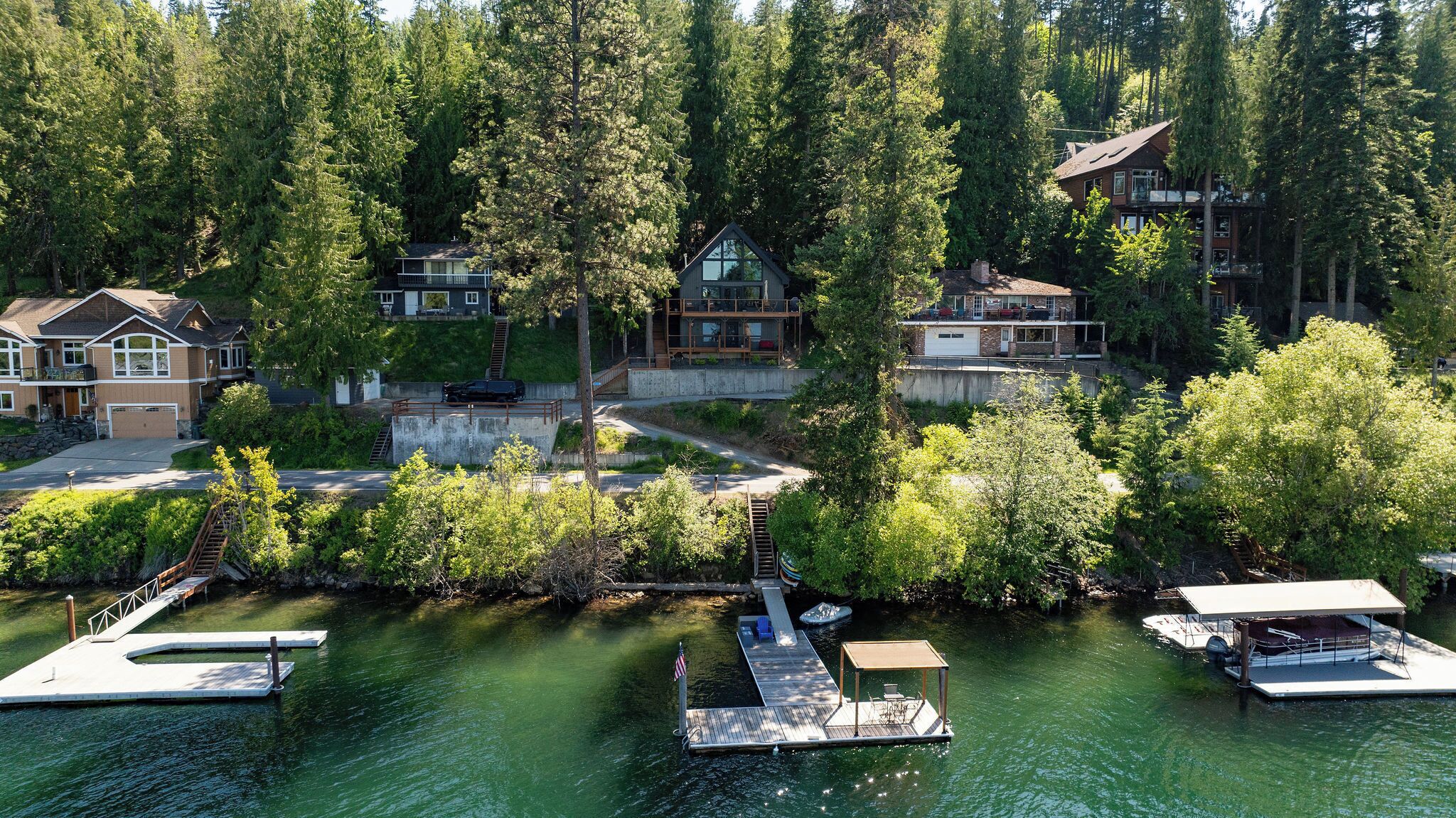 A residential area with houses, a dock, and a boat.