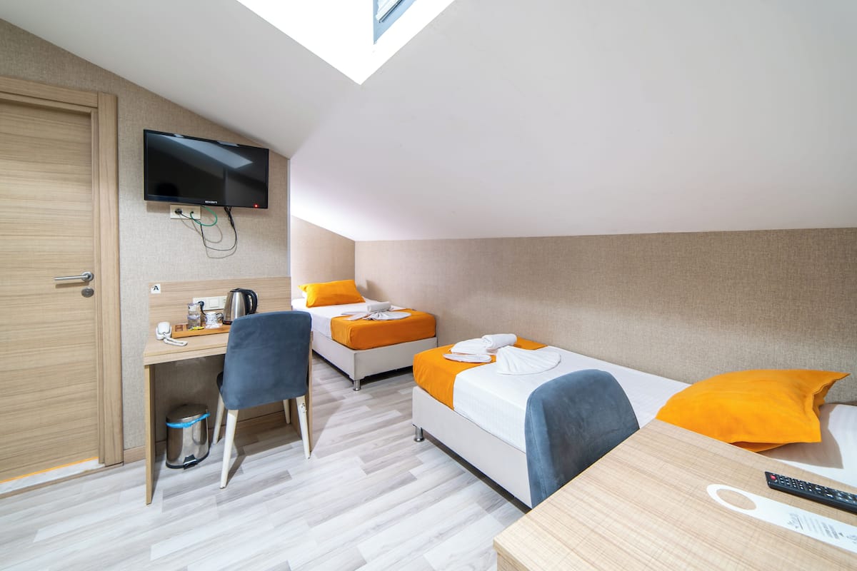 Twin Room | 2 bedrooms, in-room safe, individually decorated, individually furnished