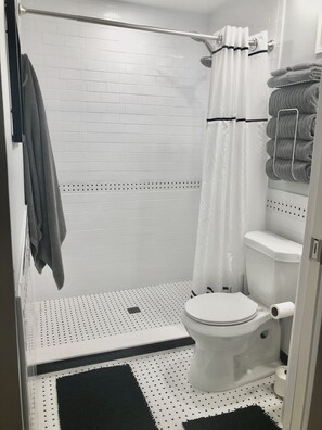 Shower, hair dryer, towels, soap