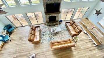 Flat-screen TV, fireplace, smart speakers