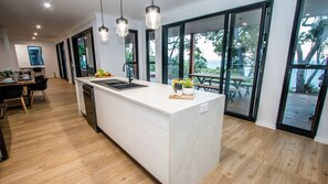 Full-sized fridge, microwave, stovetop, dishwasher